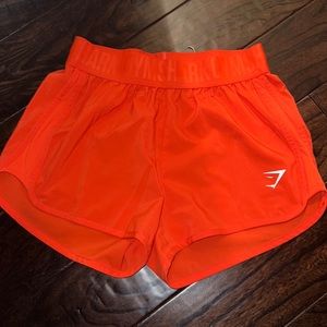 Orange gymshark training loose fit shorts size small